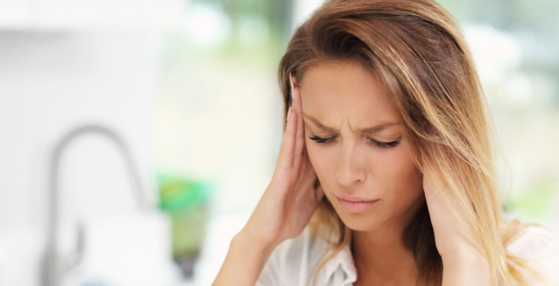 Woman with headache symptoms